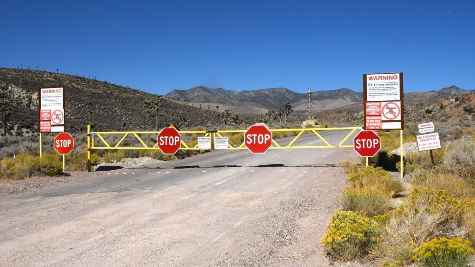 A stop sign on a road</p>
<p>Description automatically generated