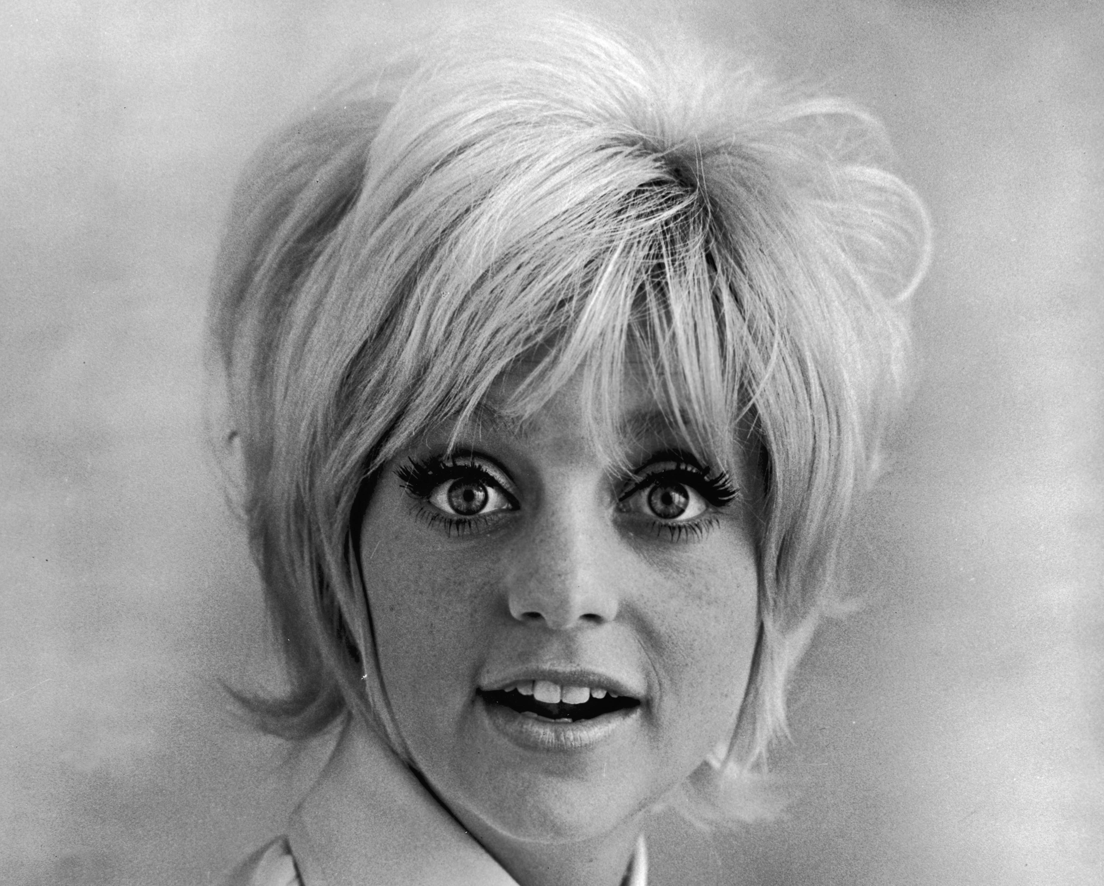 Promorional studio headshot portrait of American actor Goldie Hawn wearing a wide collared shirt for the film, 'Cactus Flower,' directed by Gene Saks, 1969. (Photo by Columbia Pictures/Authenticated News/Courtesy of Getty Images)