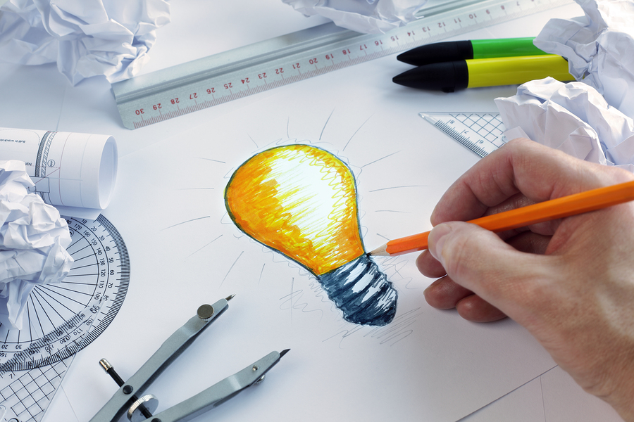 bigstock Designer drawing a light bulb 59047460 1